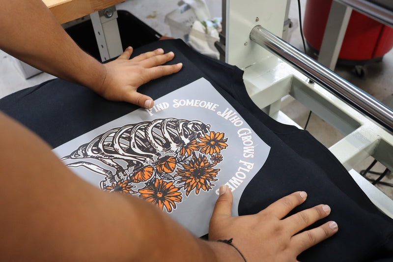 Peeling the carrier film from a pressed apparel transfer